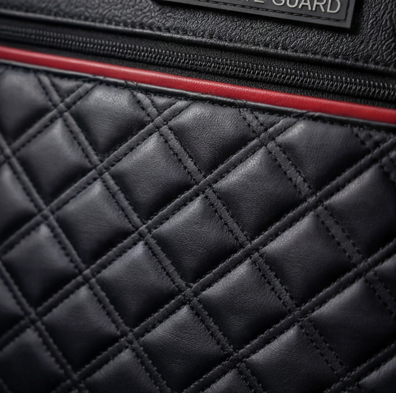 Quilted leather and red accent close-up