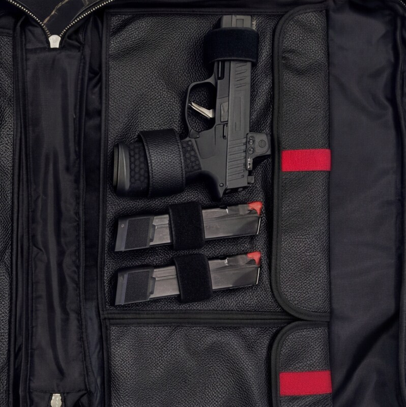 Pistol detail with optic and magazines